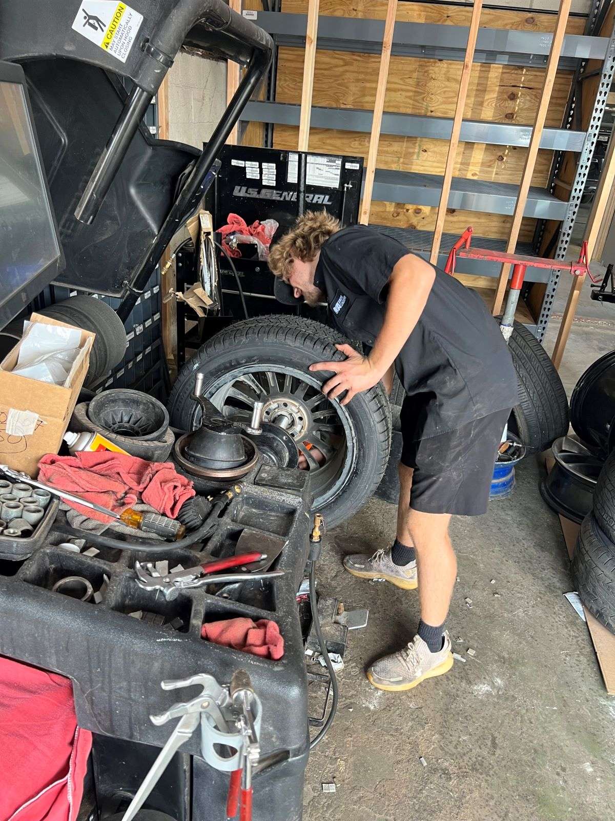 Auto-Industry Intern Replacing Tires