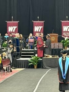 gay hibbits walking the stage at WT graduation
